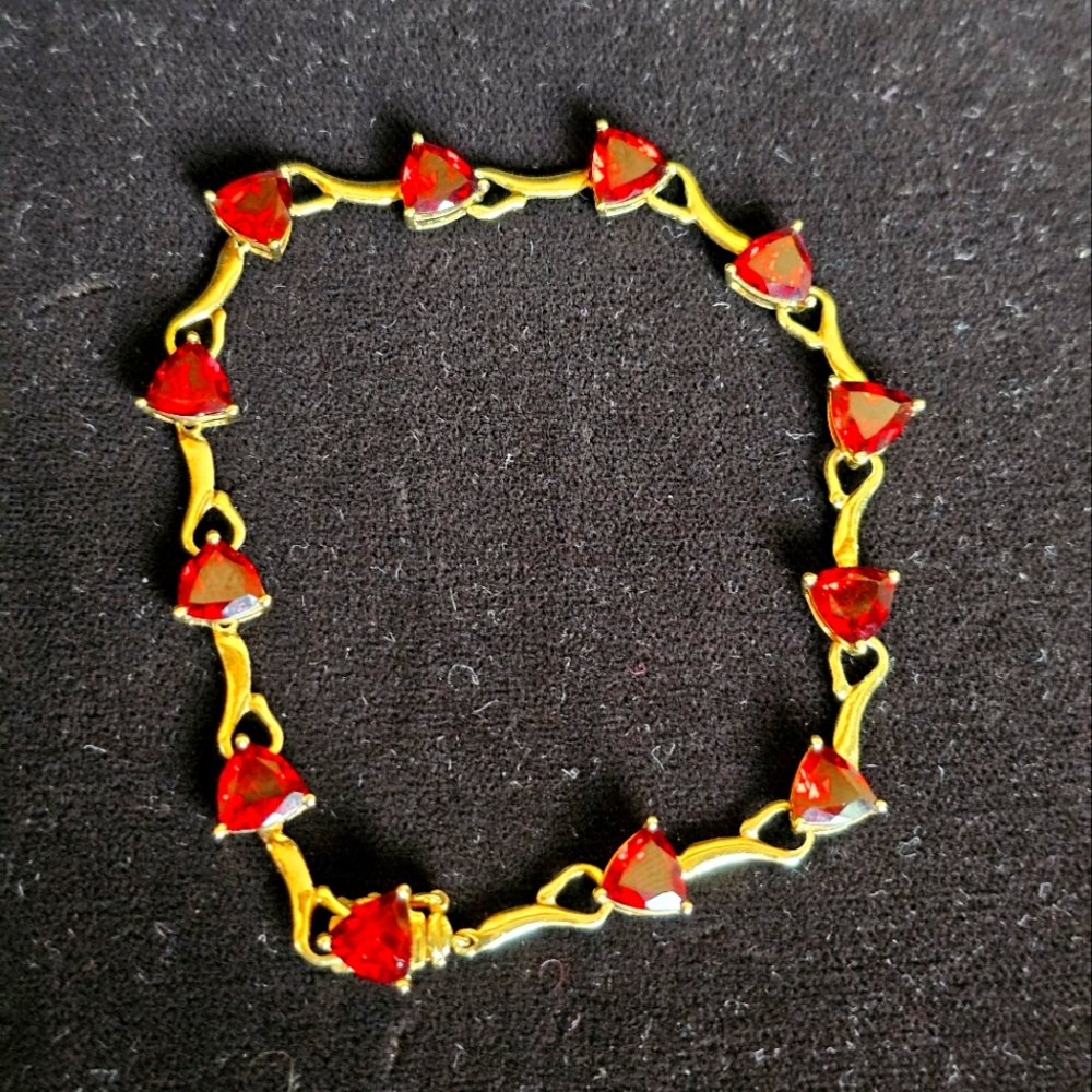 10k trillion cut garnet bracelet. Stamped 10k. Just look at this luscious red co
